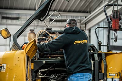 Martin technician working on machine