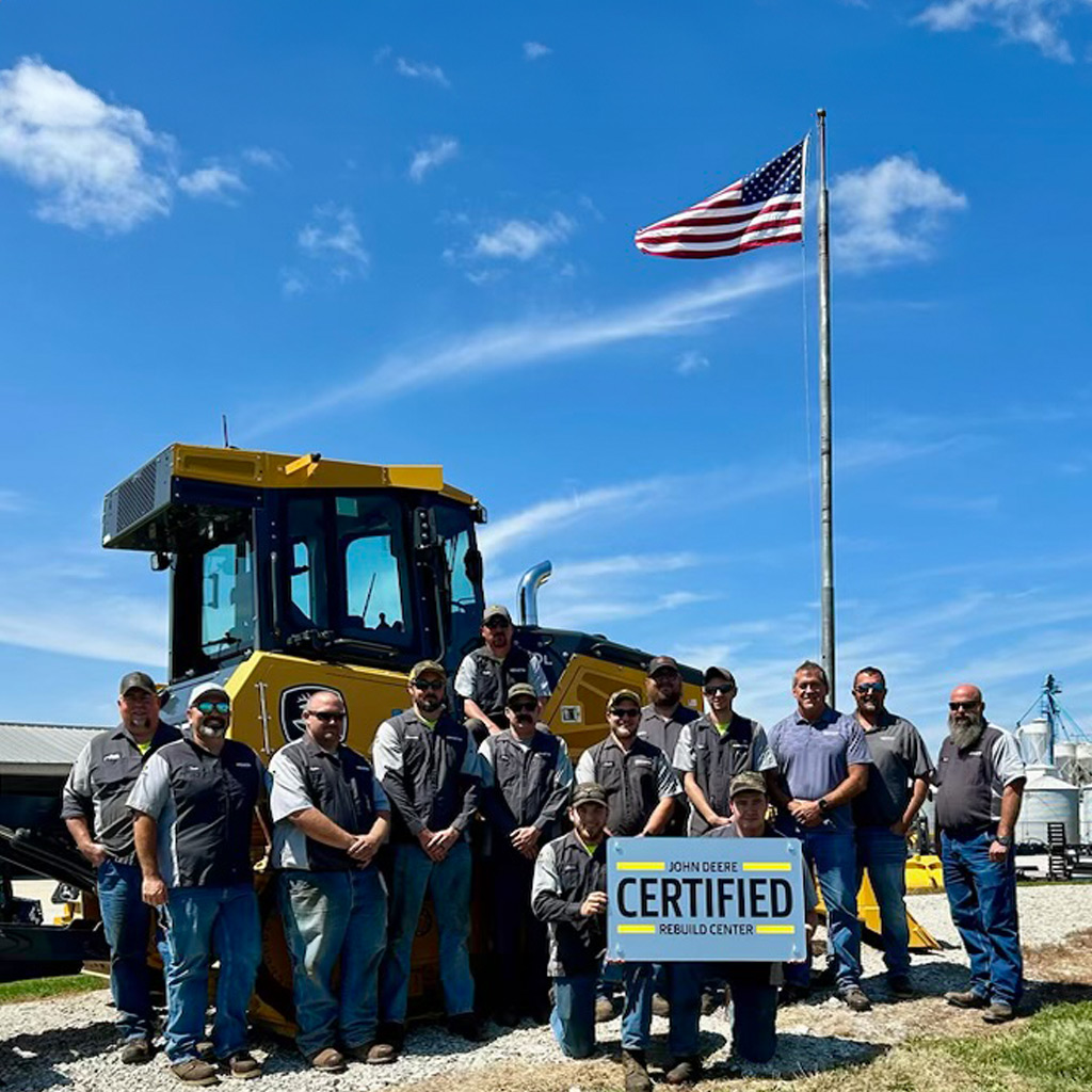 Martin team holding John Deere Certificated Rebuild Center plaque